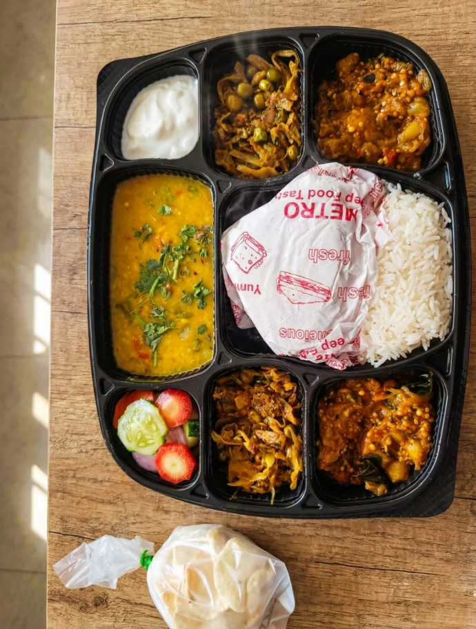 Special Indian Veg Thali packaging with dessert and multiple curries